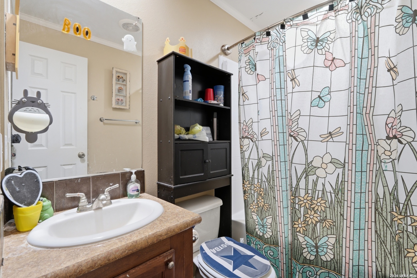 2145 Fm 2504 Poteet, TX 78065 - Photo 16 of 34 a bathroom with a granite countertop sink and a mirror