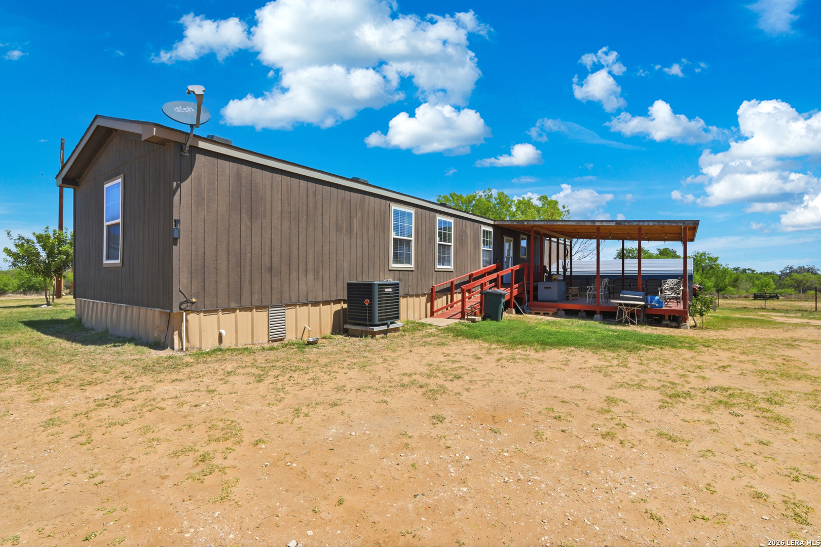 2145 Fm 2504 Poteet, TX 78065 - Photo 17 of 34 a view of a house with a patio