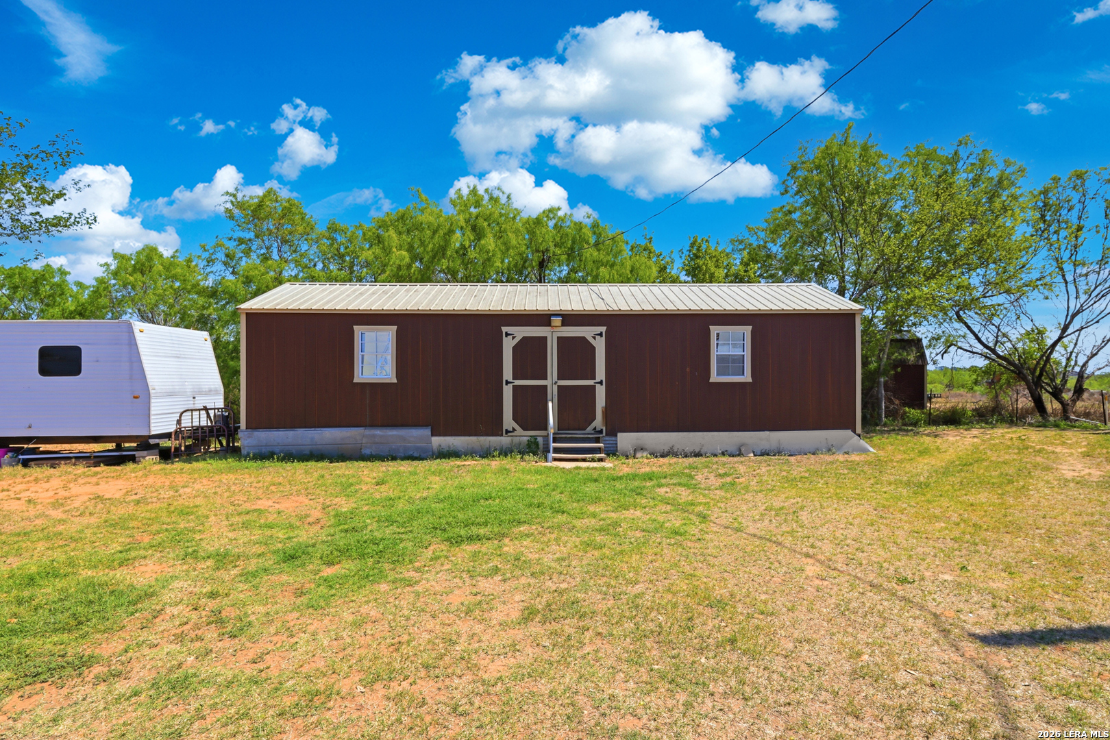 2145 Fm 2504 Poteet, TX 78065 - Photo 20 of 34 a view of an house with backyard space and garden