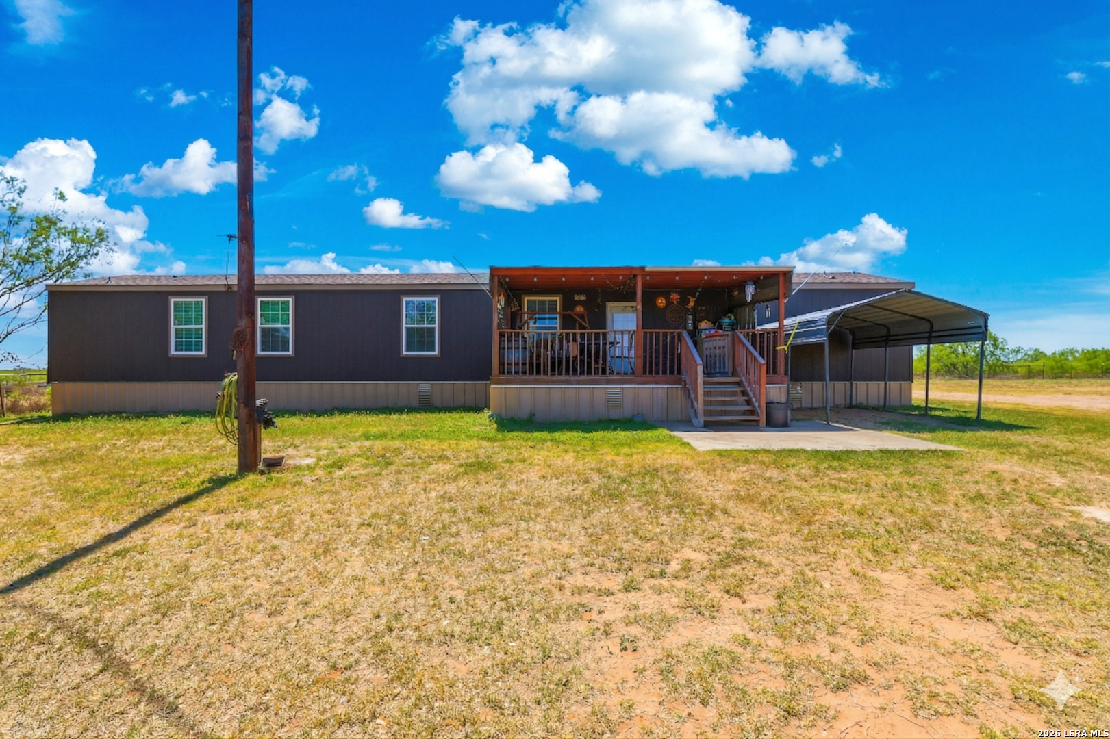 2145 Fm 2504 Poteet, TX 78065 - Photo 2 of 34 a view of a house with a backyard