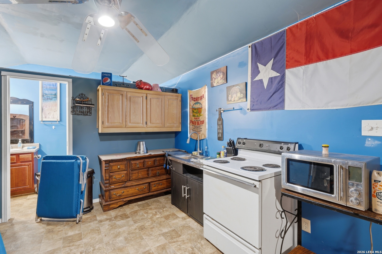2145 Fm 2504 Poteet, TX 78065 - Photo 24 of 34 a utility room with cabinets dryer and washer
