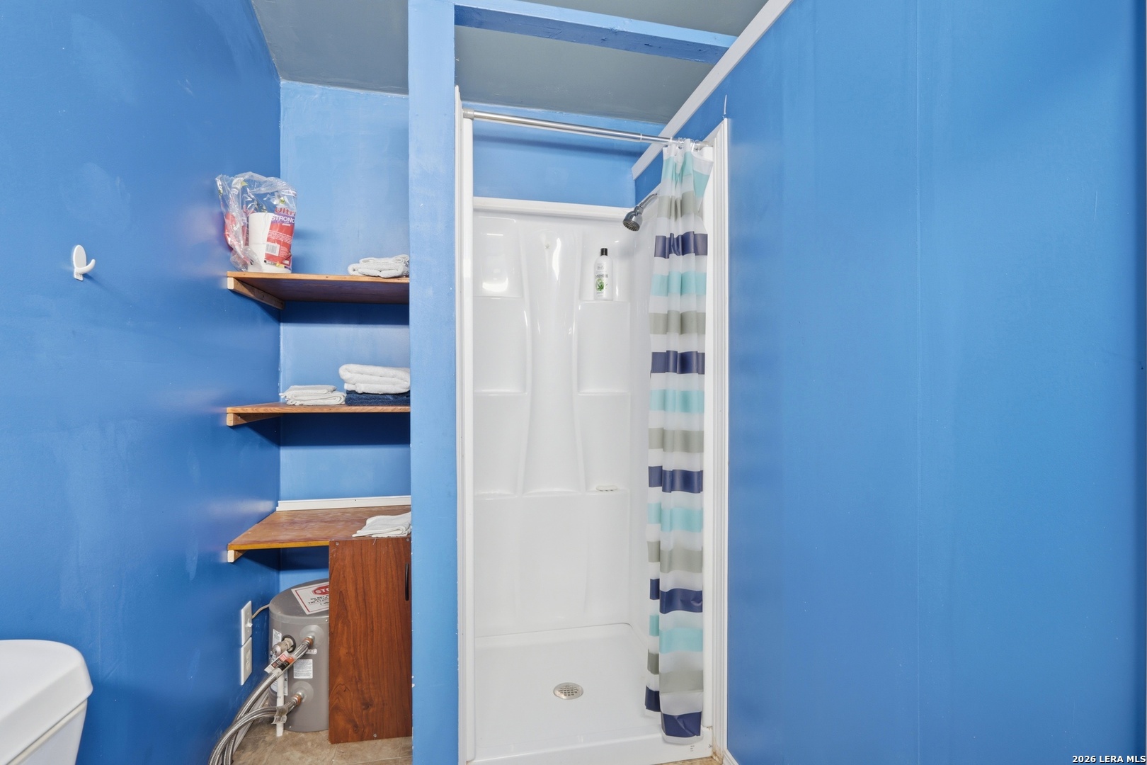 2145 Fm 2504 Poteet, TX 78065 - Photo 27 of 34 a bathroom with a shower