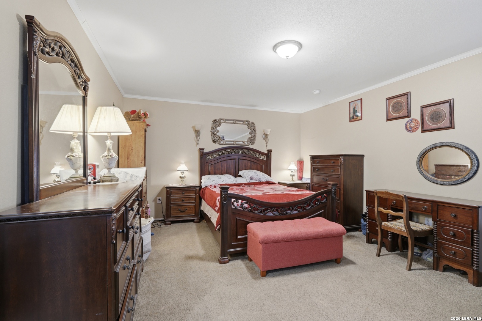 2145 Fm 2504 Poteet, TX 78065 - Photo 10 of 34 a bedroom with a bed and a chandelier