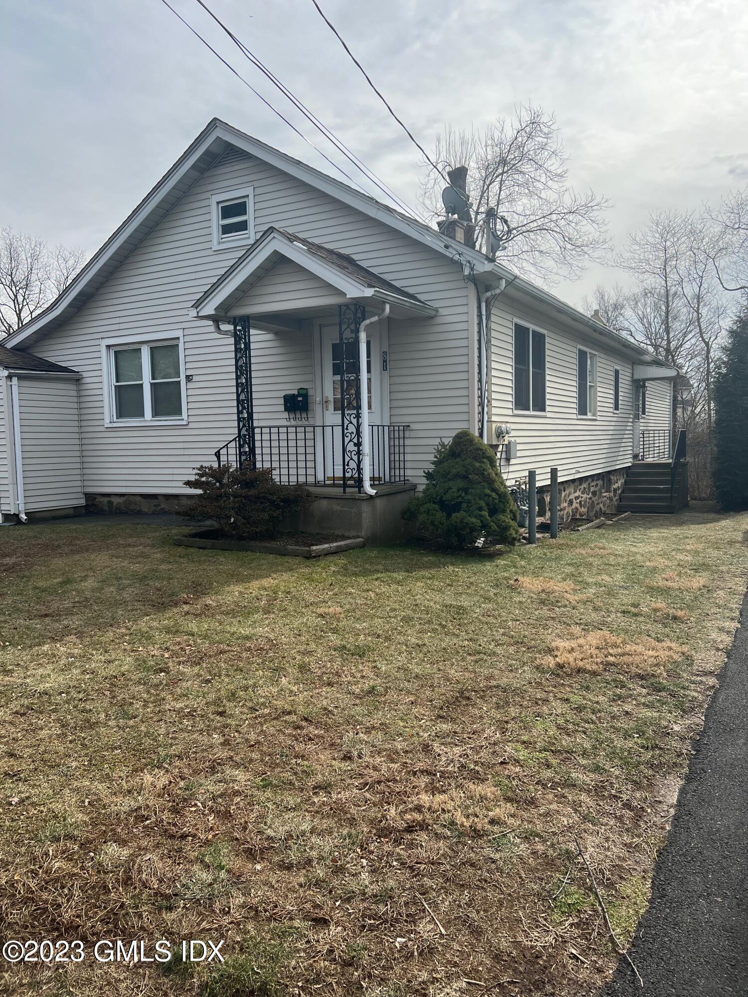 81 View Street West Greenwich, CT 06830 - Photo 1 of 12 a view of a house with a garden