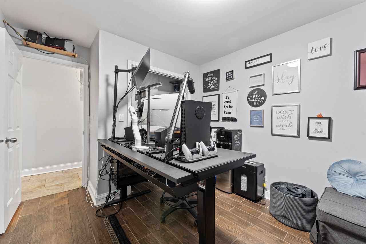 3106 South Wells Street, Unit 1 Chicago, IL 60616 - Photo 31 of 36 a view of a workspace with furniture and wooden floor