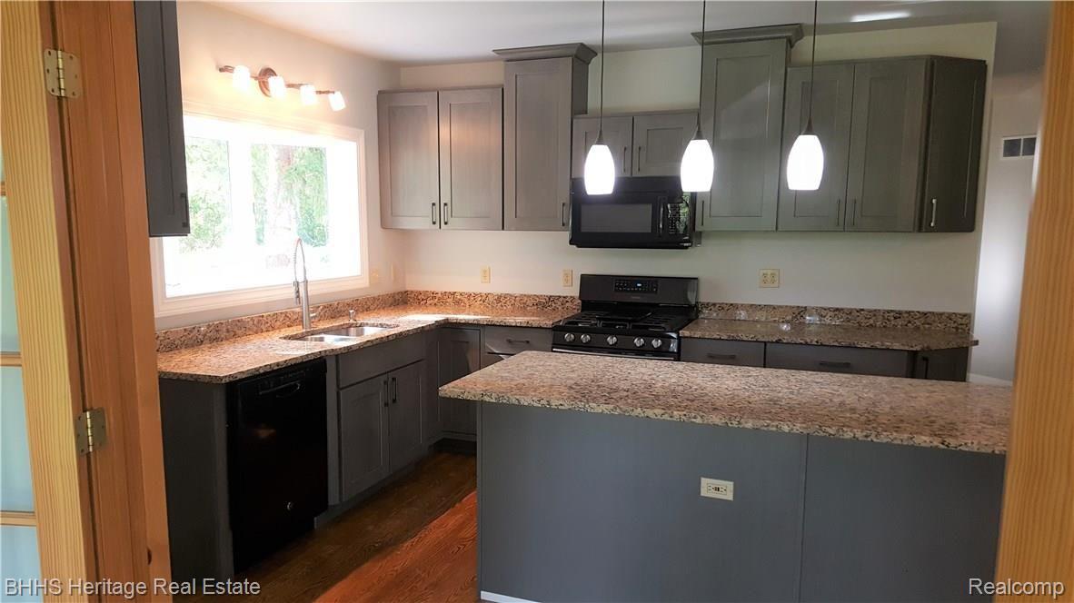 9173 Gould Road Linden, MI 48451 - Photo 13 of 34 kitchen cabinet.jpg