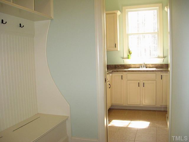 3740 Mason Road New Hill, NC 27562 - Photo 9 of 20 Nice mudroom/laundry with built-in cabinets Laundry Room