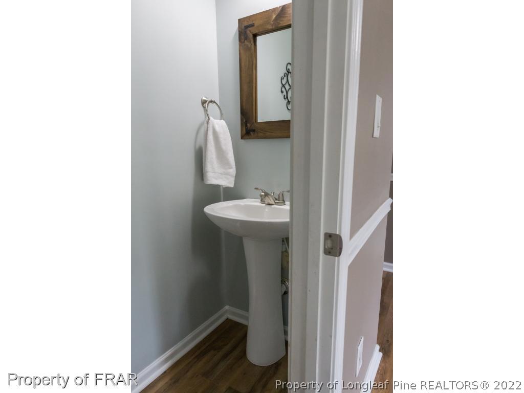 664 Cape Fear Road Raeford, NC 28376 - Photo 15 of 36 a bathroom with a sink and a mirror