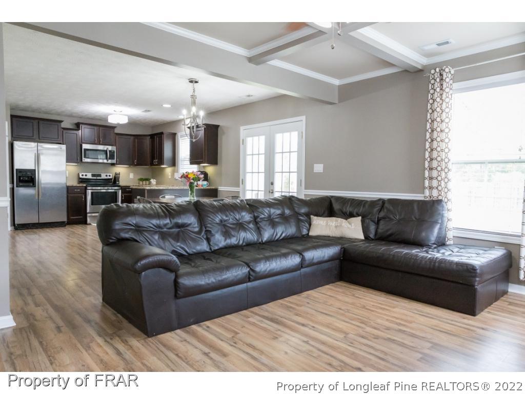 664 Cape Fear Road Raeford, NC 28376 - Photo 5 of 36 a living room with furniture and a large window