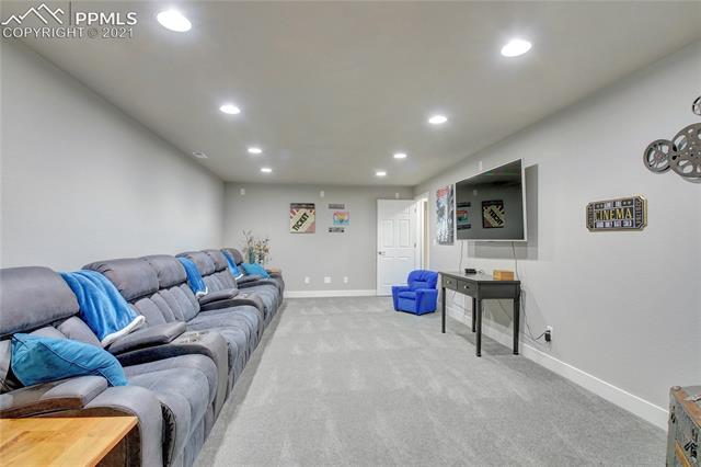 9947 Rockingham Drive Peyton, CO 80831 - Photo 31 of 43 Basement theatre/entertainment area