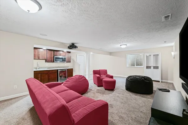 a bedroom with furniture and a window