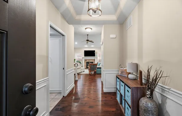 a view of a livingroom with furniture and a flat screen tv