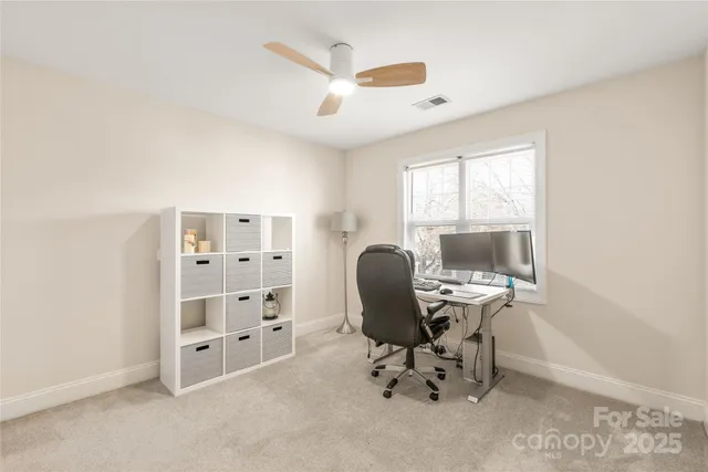 a workspace with furniture and a window