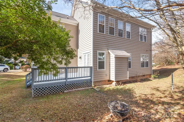 a view of a house with a fence