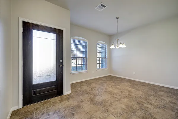 a kitchen with stainless steel appliances granite countertop a sink a stove a refrigerator and a cabinets