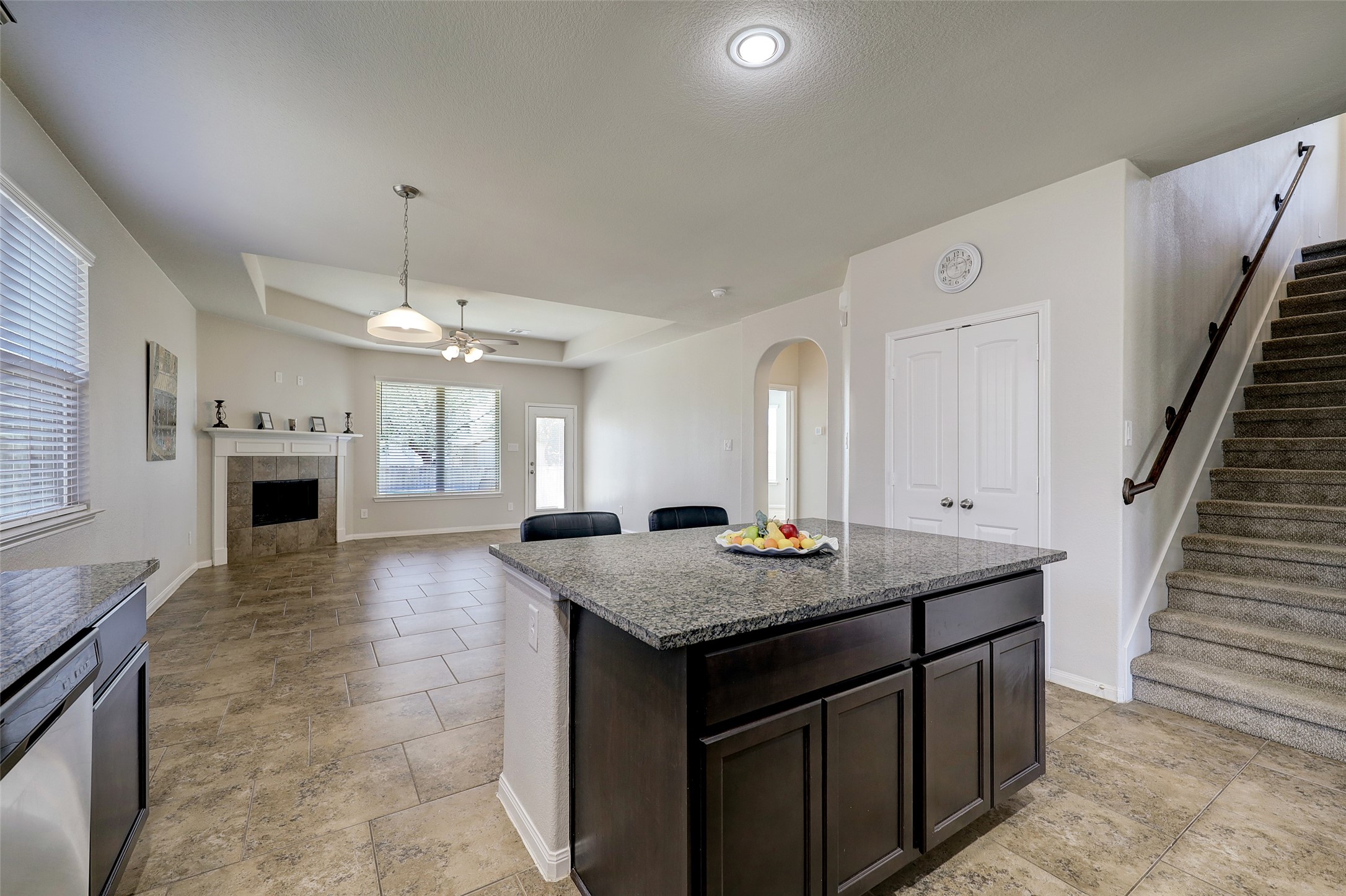 314 Moonwalk Street Montgomery, TX 77356 - Photo 5 of 21 a view of kitchen island with granite countertop living room