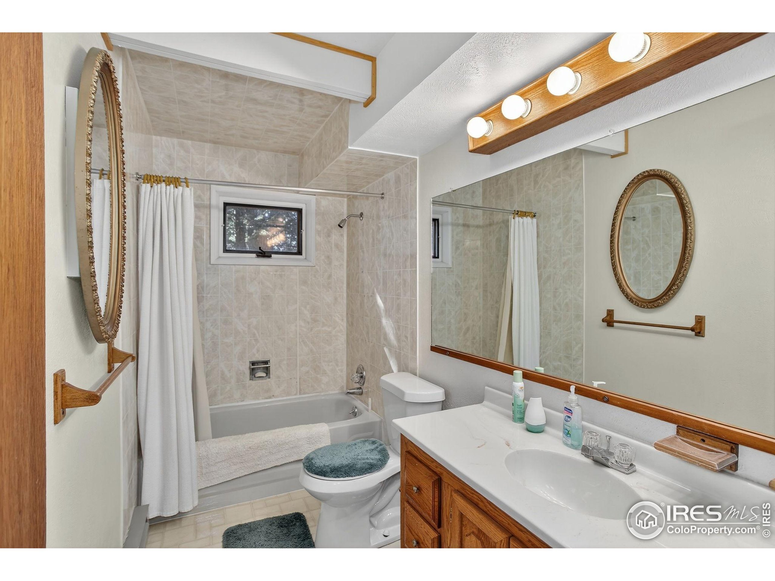 211 Hi Meadow Drive Bailey, CO 80421 - Photo 14 of 19 a bathroom with a sink a toilet and shower