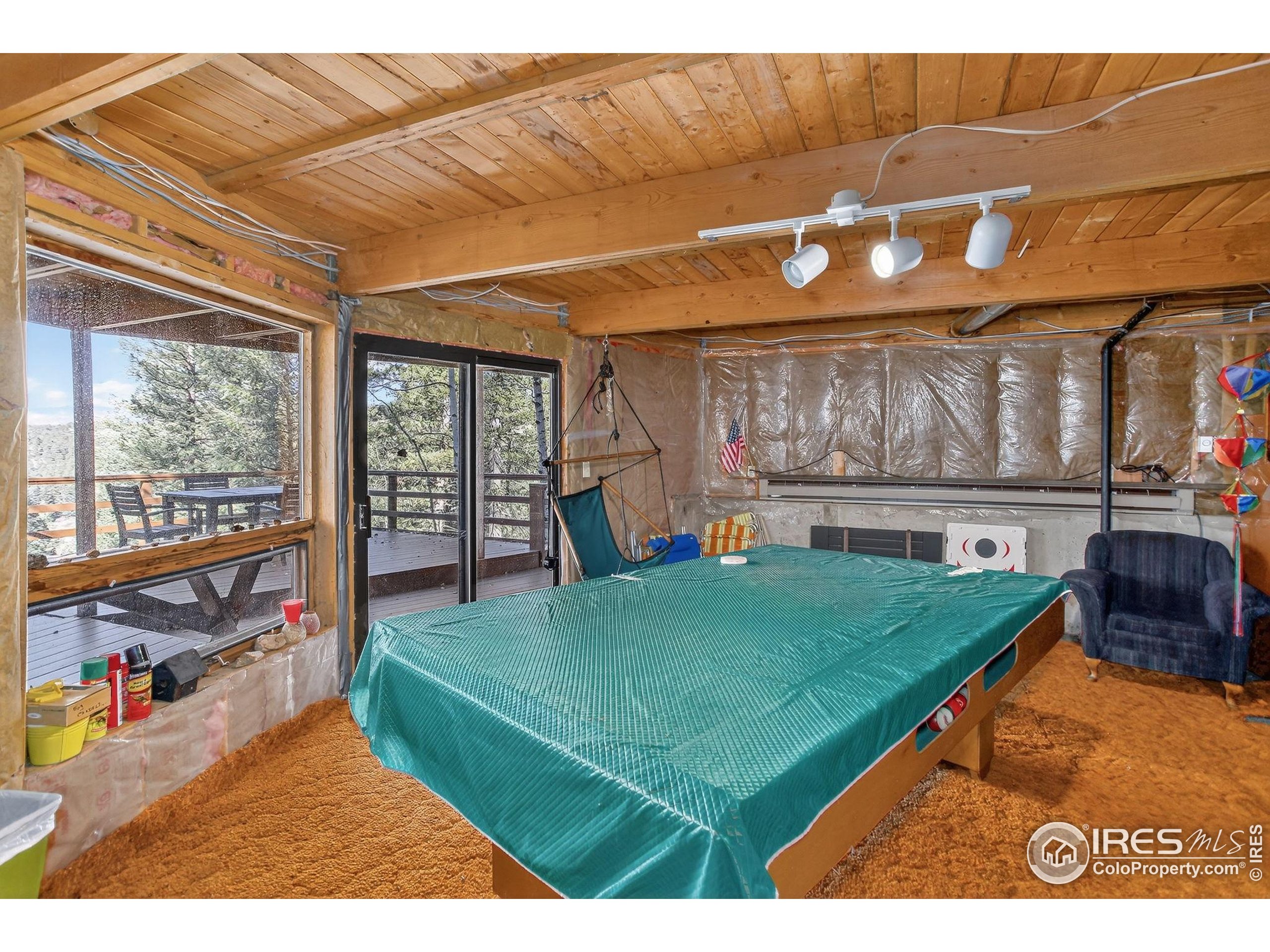 211 Hi Meadow Drive Bailey, CO 80421 - Photo 15 of 19 a living room with furniture and a table