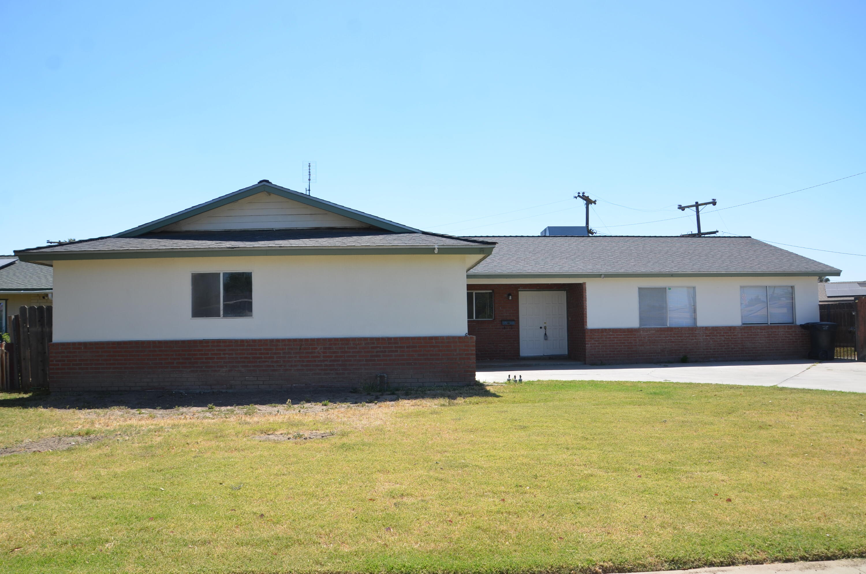 339 West Spring Lane Lemoore, CA 93245 - Photo 1 of 31 a front view of a house with a yard