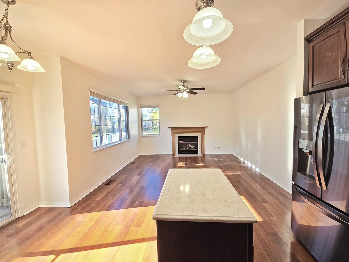 2028 Cypress Court Glendale Heights, IL 60139 - Photo 22 of 25 a view of kitchen and dining room with wooden floor