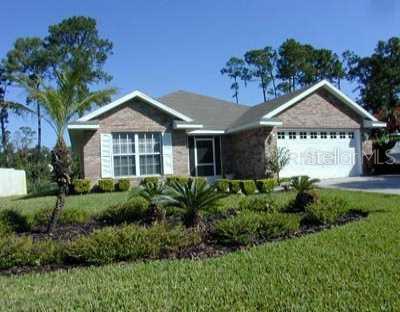 30 Bonita Road DeBary, FL 32713 - Photo 1 of 1 a front view of a house with garden