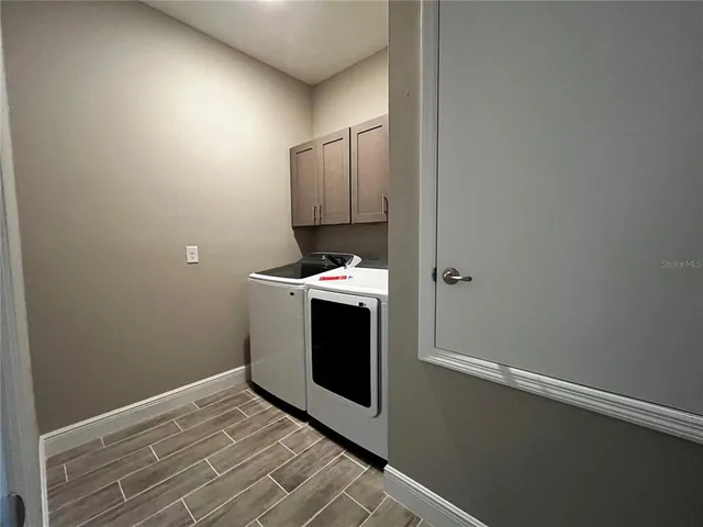 a room with a fireplace and a wooden floor