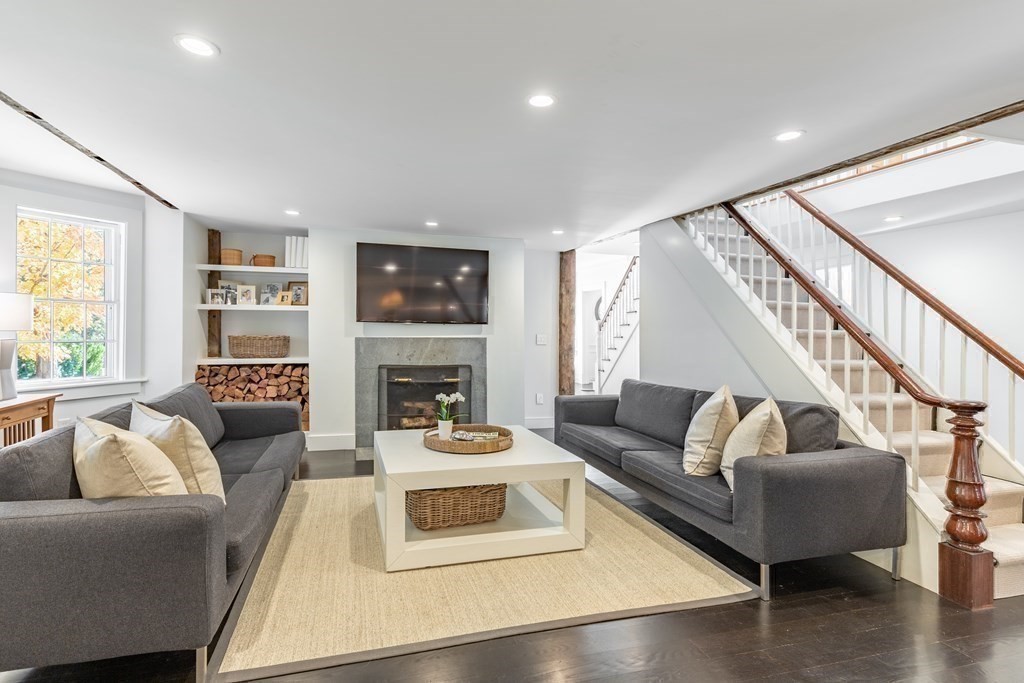 201 Lexington Road Concord, MA 01742 - Photo 11 of 41 a living room with furniture and a fireplace