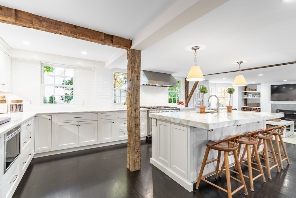 201 Lexington Road Concord, MA 01742 - Photo 15 of 41 a kitchen with white cabinets and sink