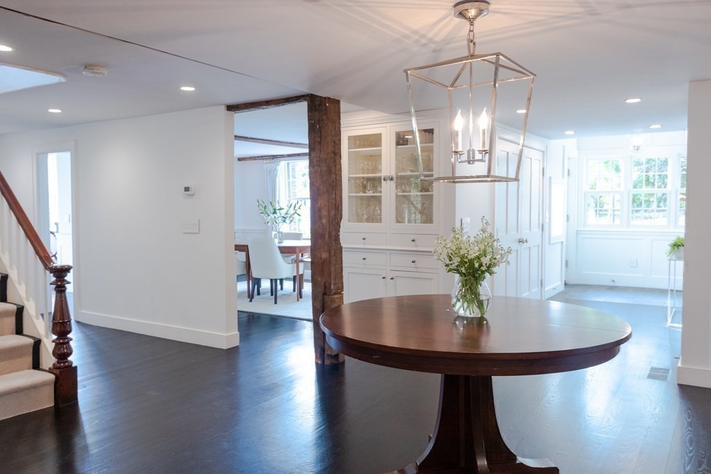 201 Lexington Road Concord, MA 01742 - Photo 17 of 41 a view of a dining room with furniture wooden floor and chandelier