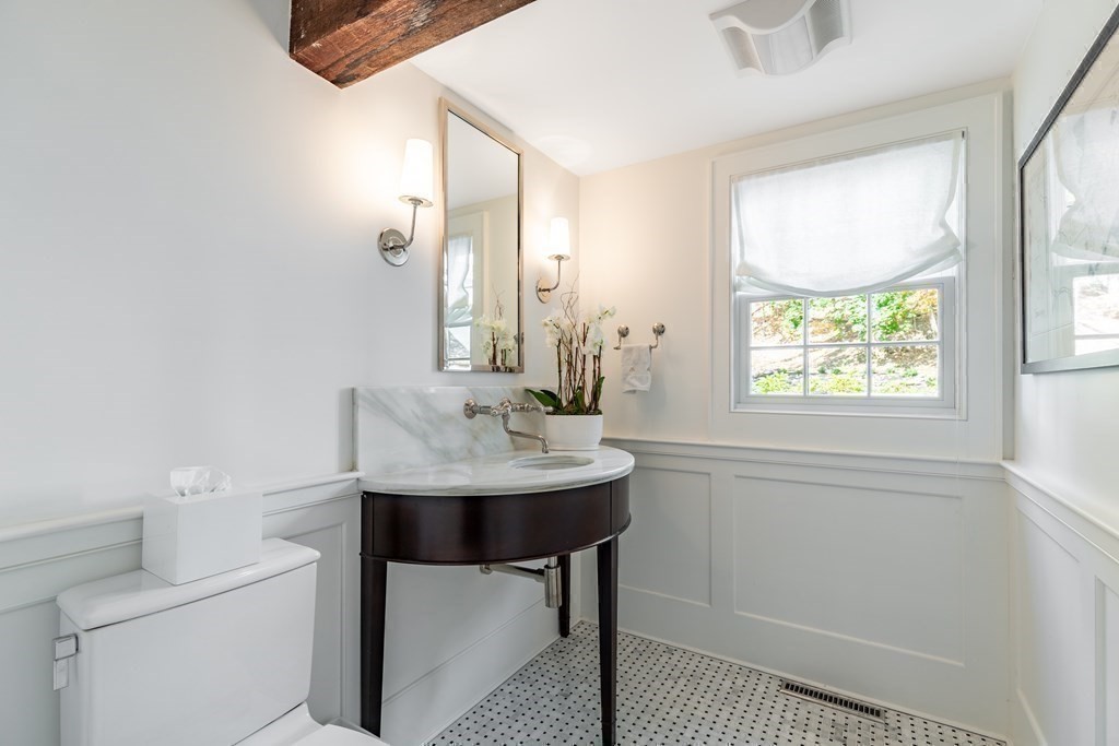201 Lexington Road Concord, MA 01742 - Photo 20 of 41 a bathroom with a sink a toilet and a mirror