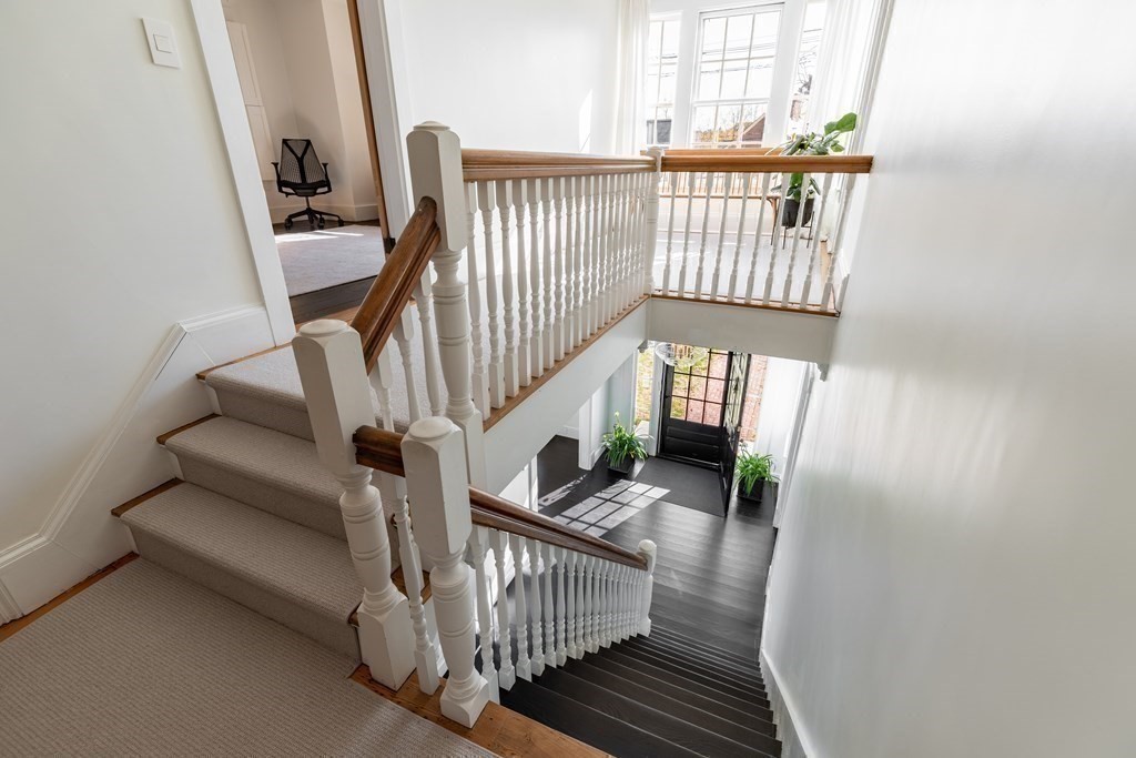 201 Lexington Road Concord, MA 01742 - Photo 21 of 41 a view of entryway with wooden floor and stairs