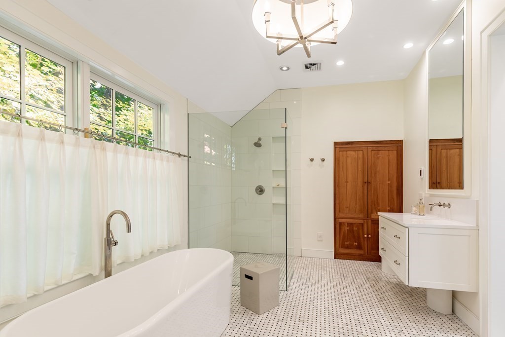 201 Lexington Road Concord, MA 01742 - Photo 25 of 41 a bathroom with a sink a toilet and shower