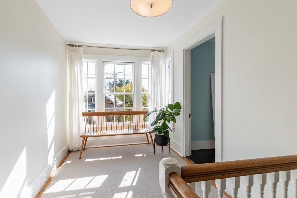 201 Lexington Road Concord, MA 01742 - Photo 26 of 41 a view of entryway with wooden floor and a potted plant