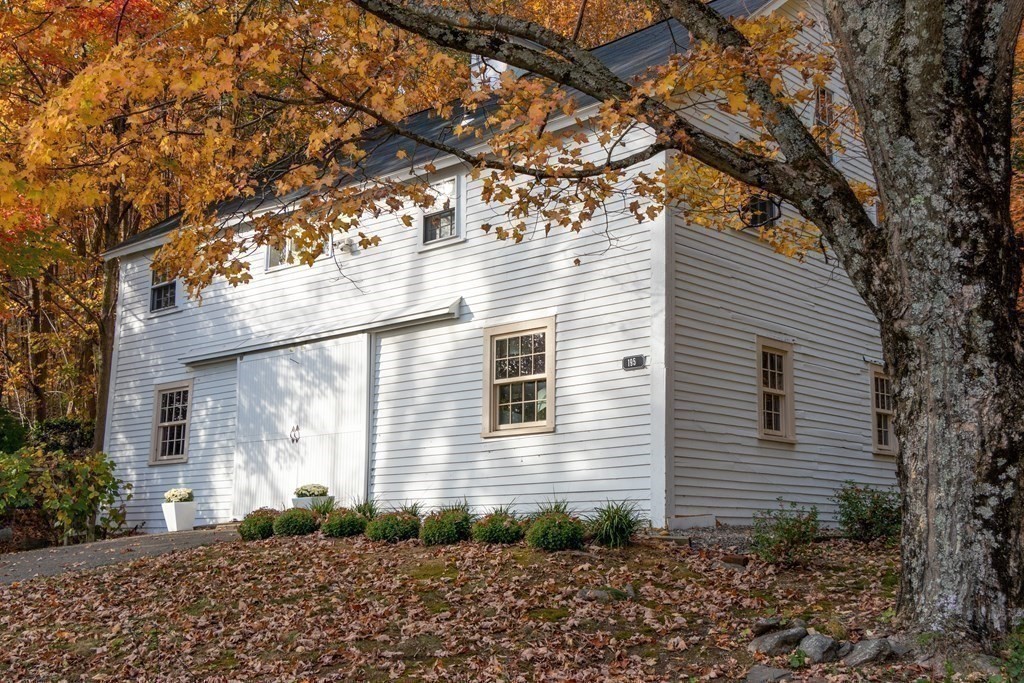 201 Lexington Road Concord, MA 01742 - Photo 34 of 41 a front view of a house with garden
