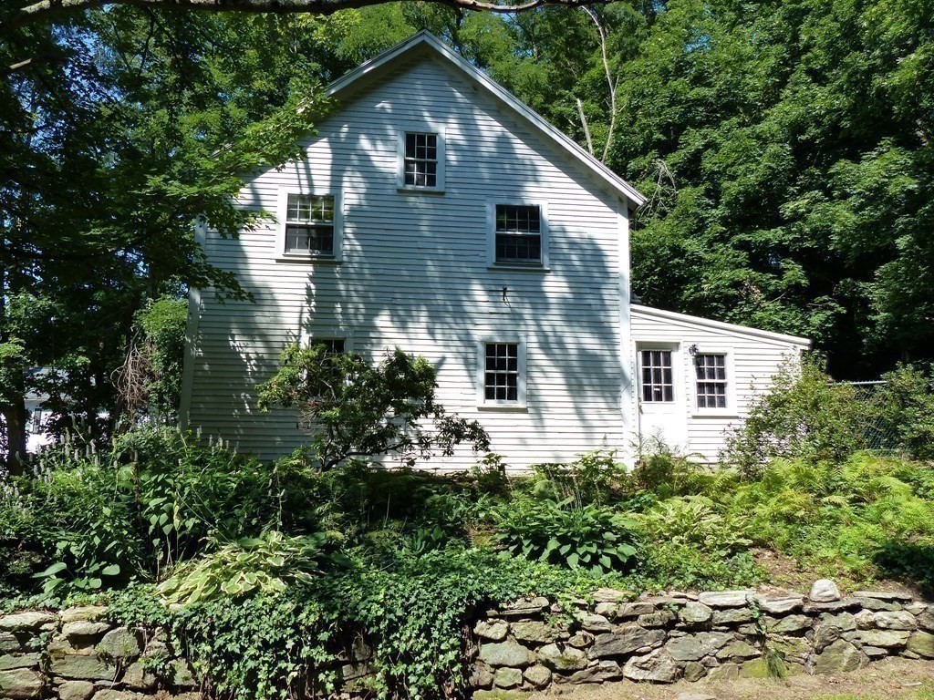 201 Lexington Road Concord, MA 01742 - Photo 35 of 41 a view of a house with a yard and plants