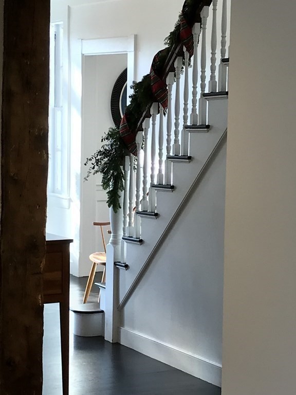 201 Lexington Road Concord, MA 01742 - Photo 39 of 41 a view of entryway and hall with wooden floor