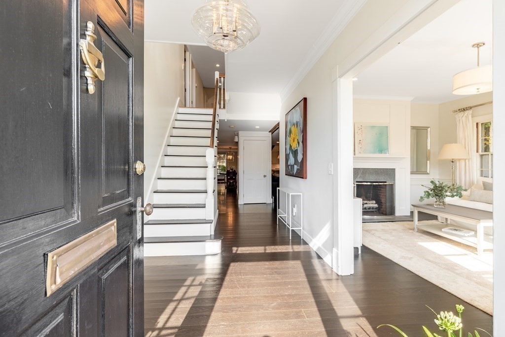 201 Lexington Road Concord, MA 01742 - Photo 5 of 41 a view of a hallway with a chandelier and livingroom view