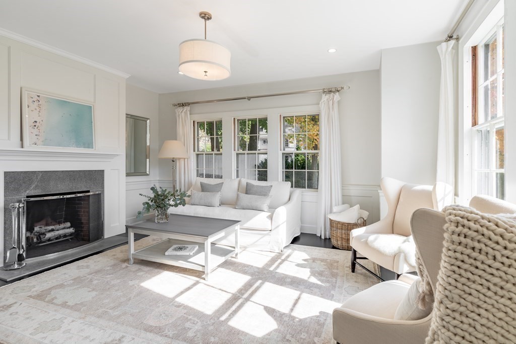 201 Lexington Road Concord, MA 01742 - Photo 7 of 41 a living room with furniture and a fireplace