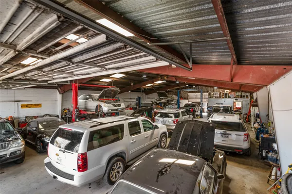 a view of a garage with a car and car