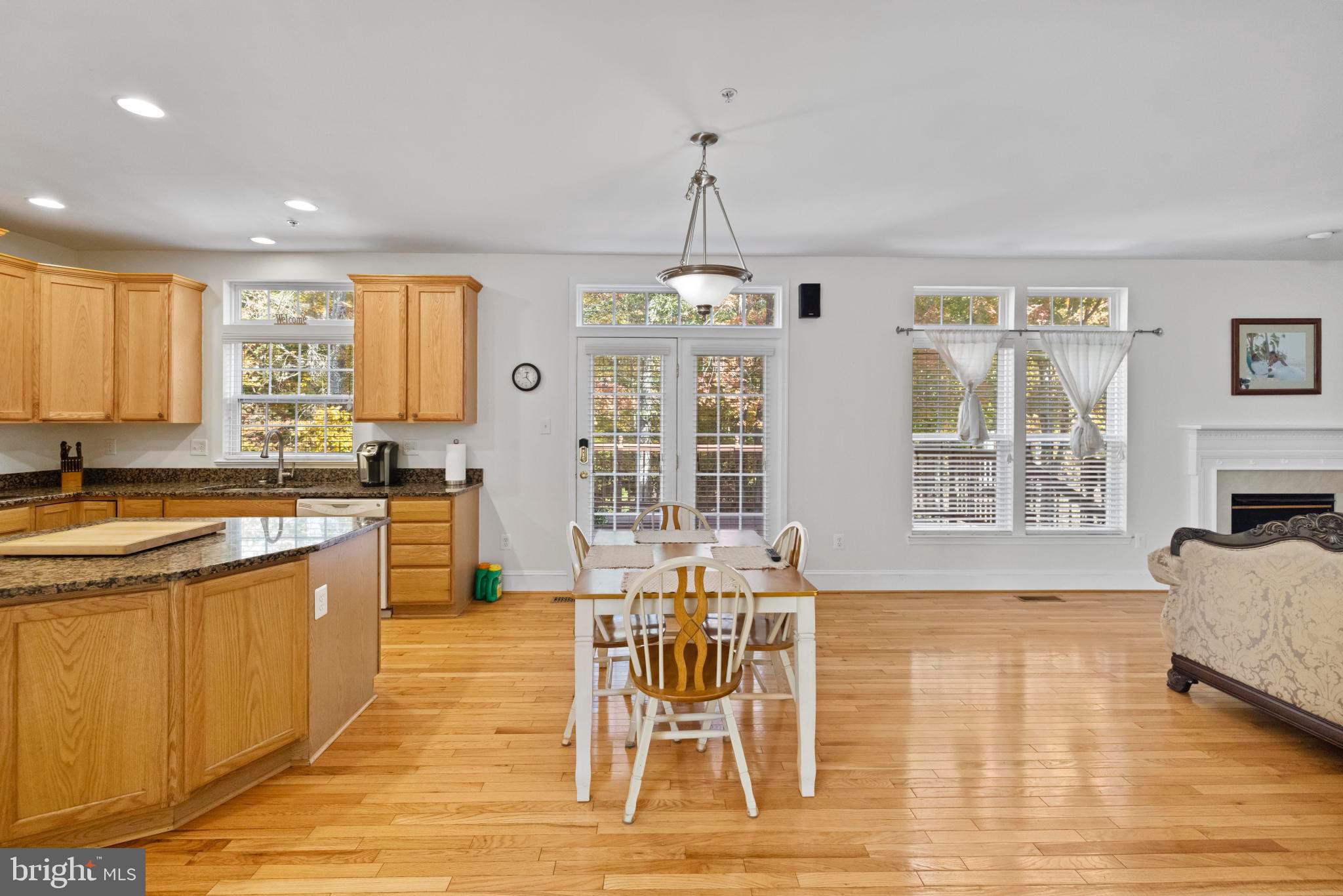 8008 Dorado Terrace Brandywine, MD 20613 - Photo 16 of 55 a view of a dining room with furniture window and wooden floor