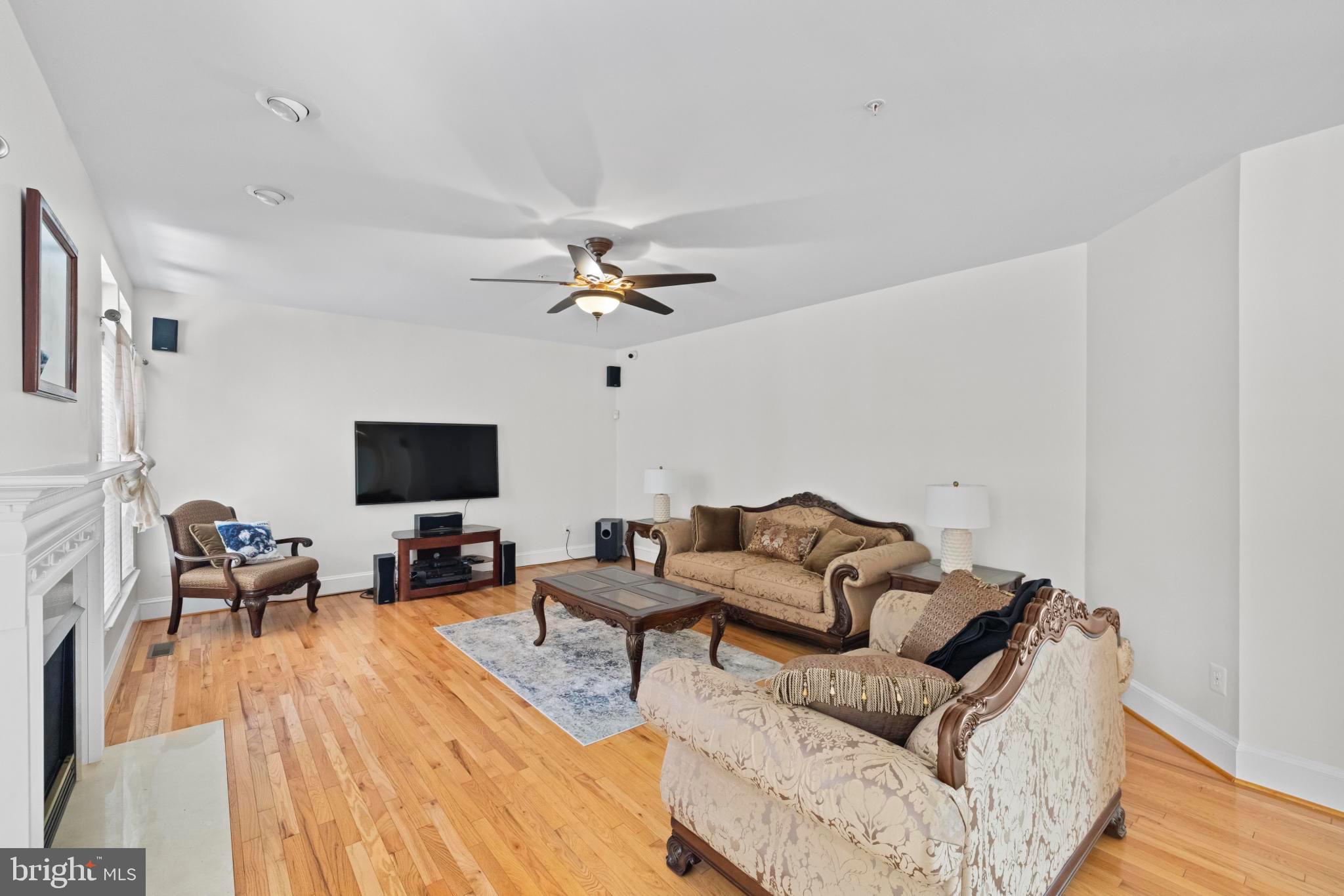 8008 Dorado Terrace Brandywine, MD 20613 - Photo 17 of 55 a living room with furniture and a flat screen tv
