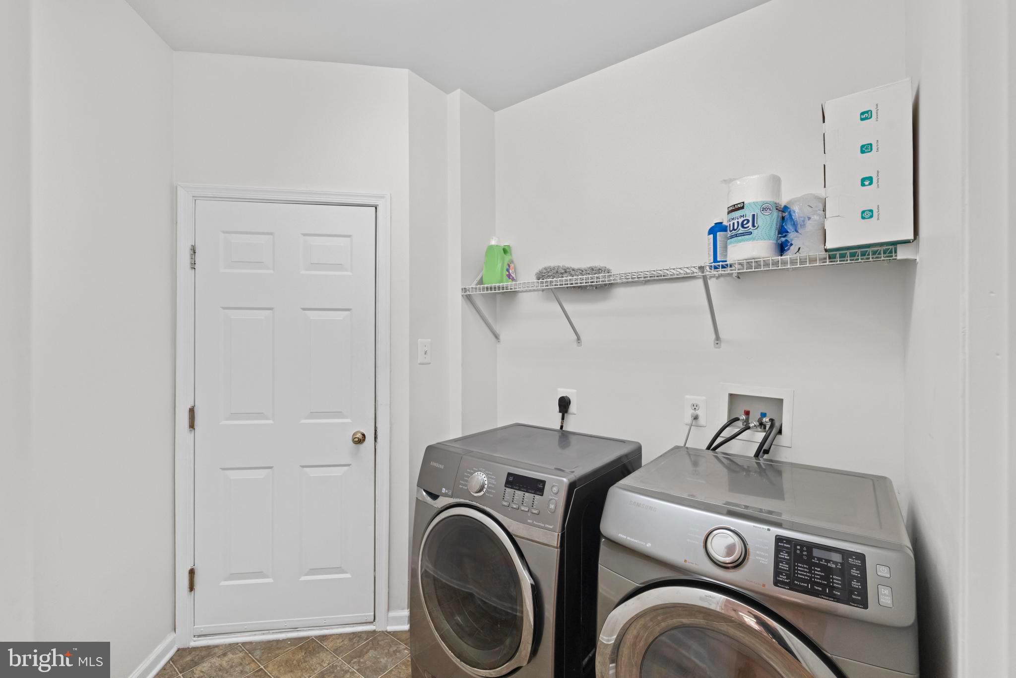 8008 Dorado Terrace Brandywine, MD 20613 - Photo 22 of 55 a utility room with dryer and washer