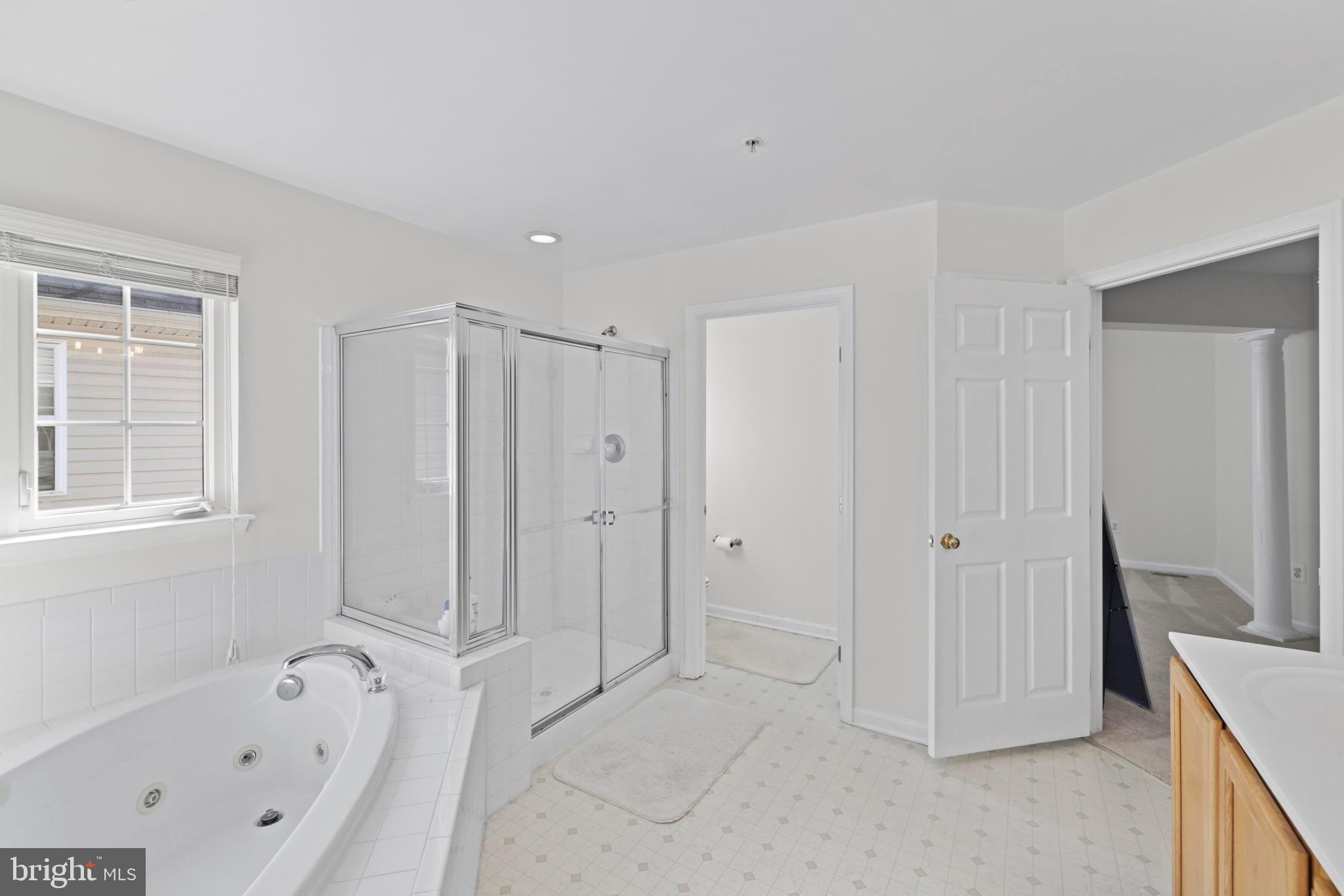 8008 Dorado Terrace Brandywine, MD 20613 - Photo 35 of 55 a bathroom with a bathtub and a shower