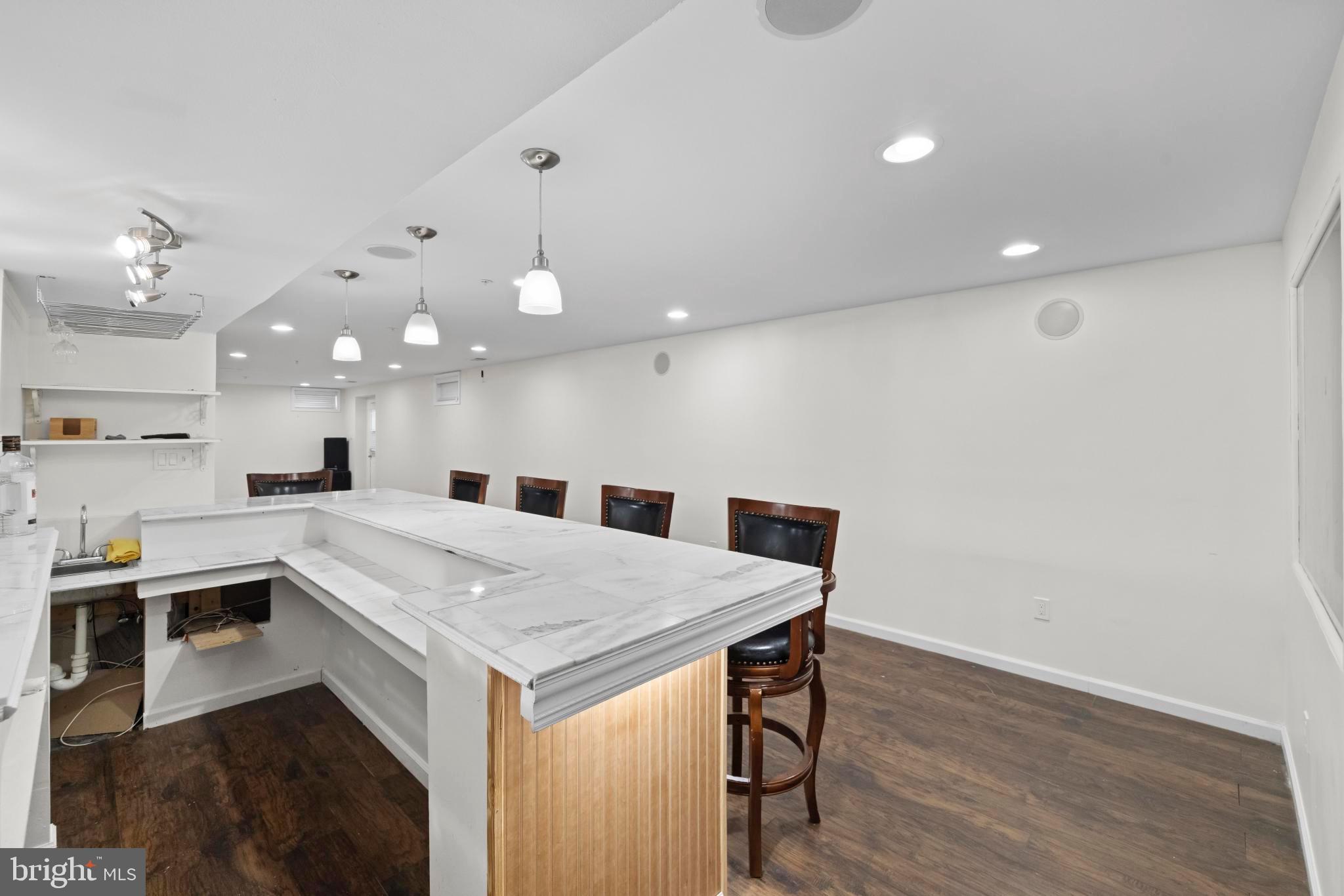 8008 Dorado Terrace Brandywine, MD 20613 - Photo 49 of 55 a kitchen with a stove a sink and a refrigerator
