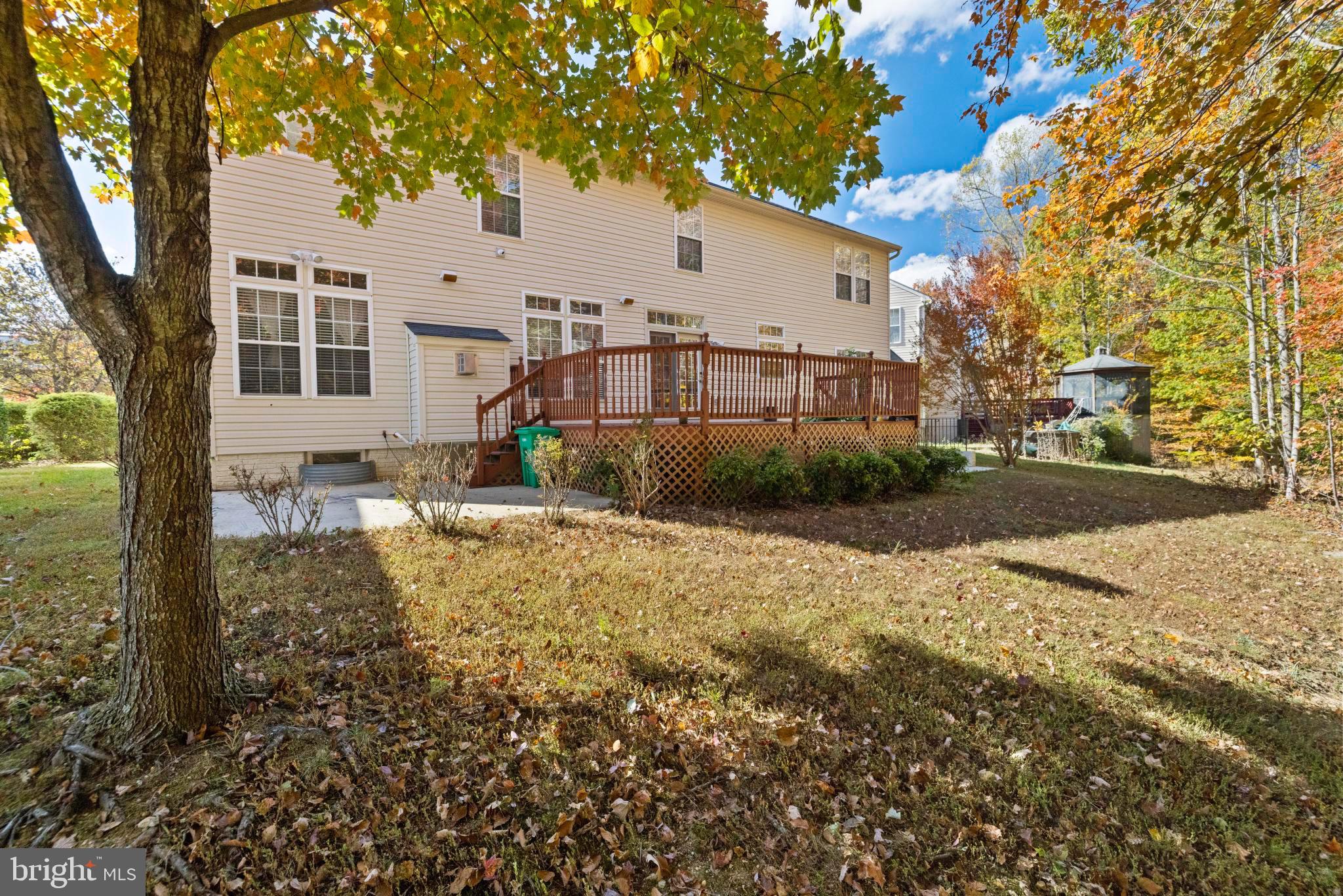 8008 Dorado Terrace Brandywine, MD 20613 - Photo 53 of 55 a view of a white house that has a tree in it