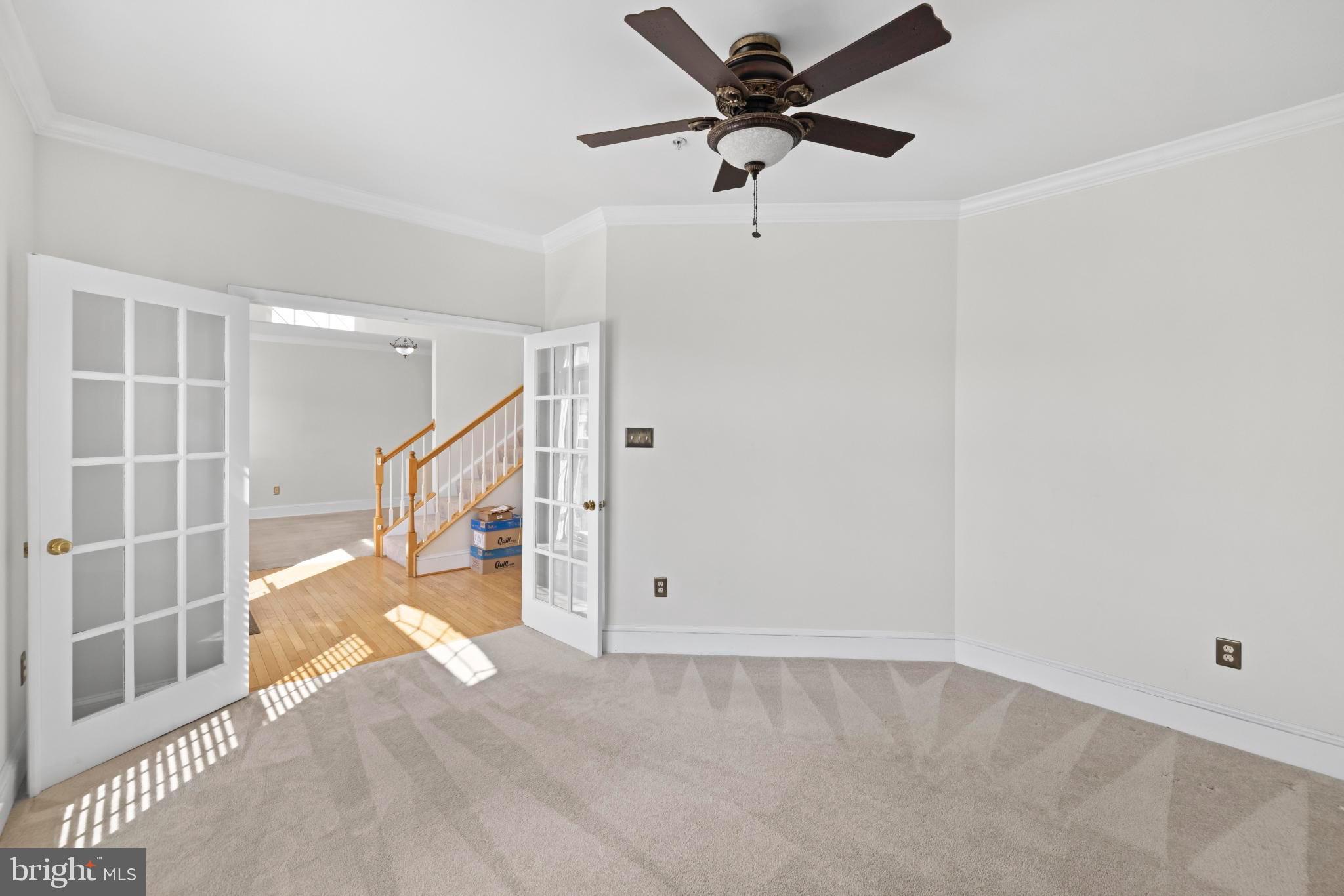 8008 Dorado Terrace Brandywine, MD 20613 - Photo 6 of 55 an empty room with wooden floor and windows
