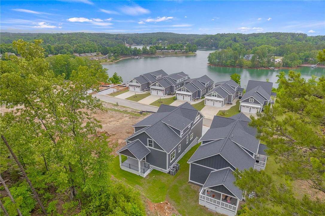 1230 Melton Road, Unit 216 West Union, SC 29696 - Photo 38 of 49 Perched above a serene lake, these newly constructed homes offer an idyllic waterside community lifestyle.