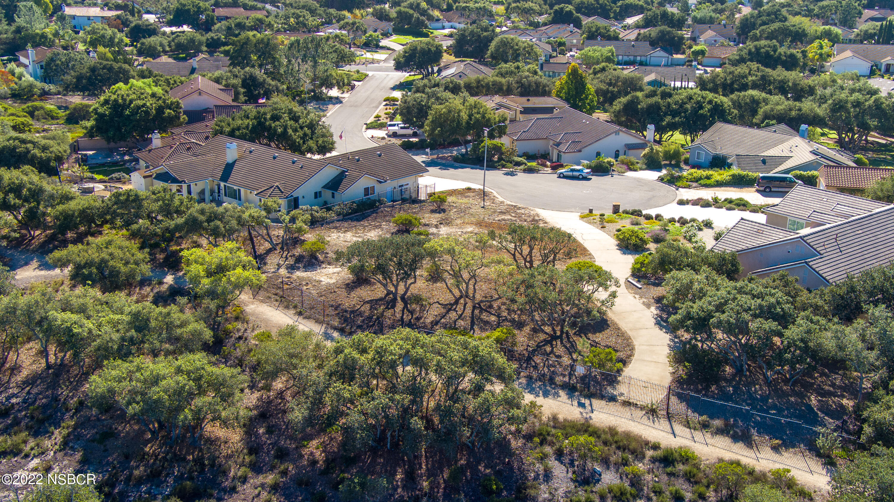 1212 Harris Drive Lompoc, CA 93436 - Photo 16 of 29 an aerial view of residential houses with outdoor space and trees all around