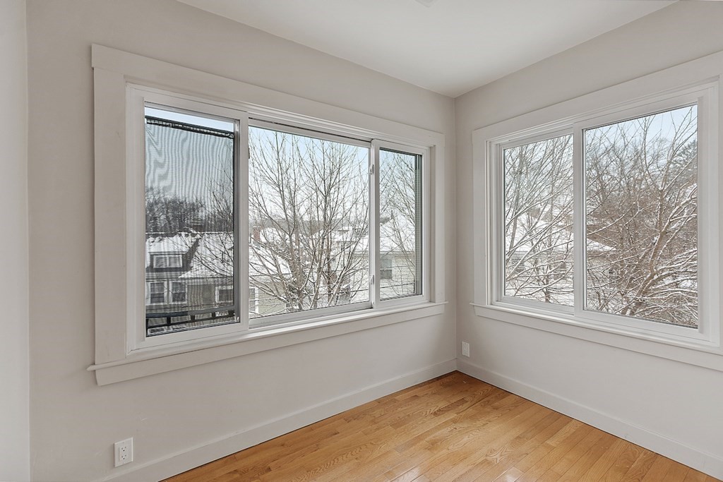 42 Radnor Road Boston, MA 02135 - Photo 13 of 17 a view of an empty room with a window