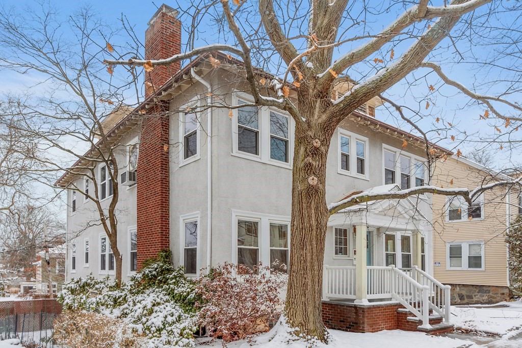42 Radnor Road Boston, MA 02135 - Photo 15 of 17 a front view of a house with a tree